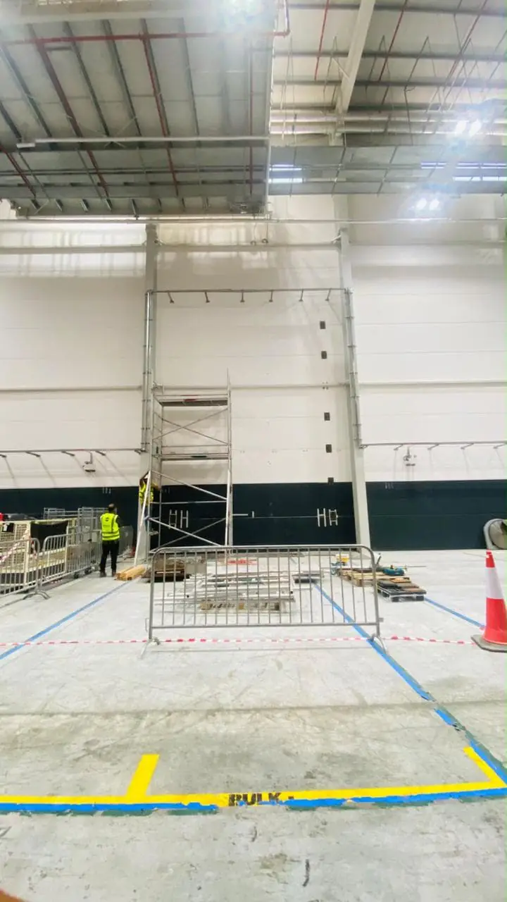 High-wall works in a logistics warehouse, site view 2